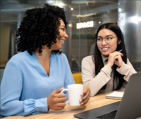 Two colleagues collaborating in a modern office